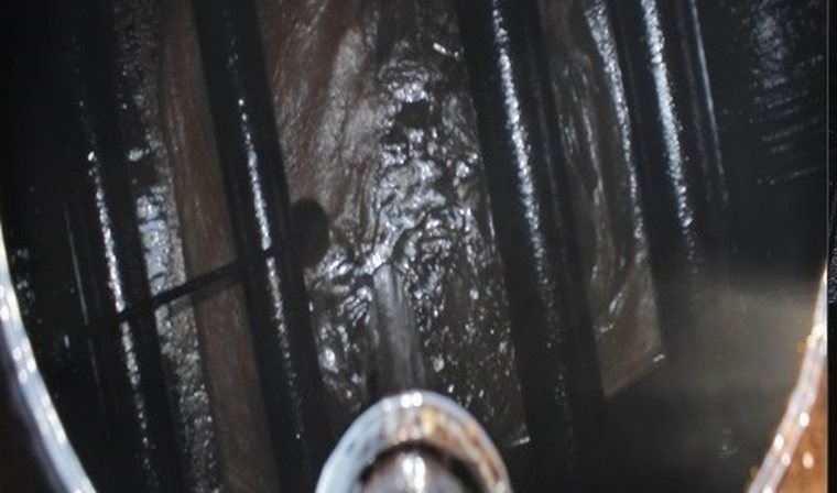 Asphalt distributor tank before cleaning